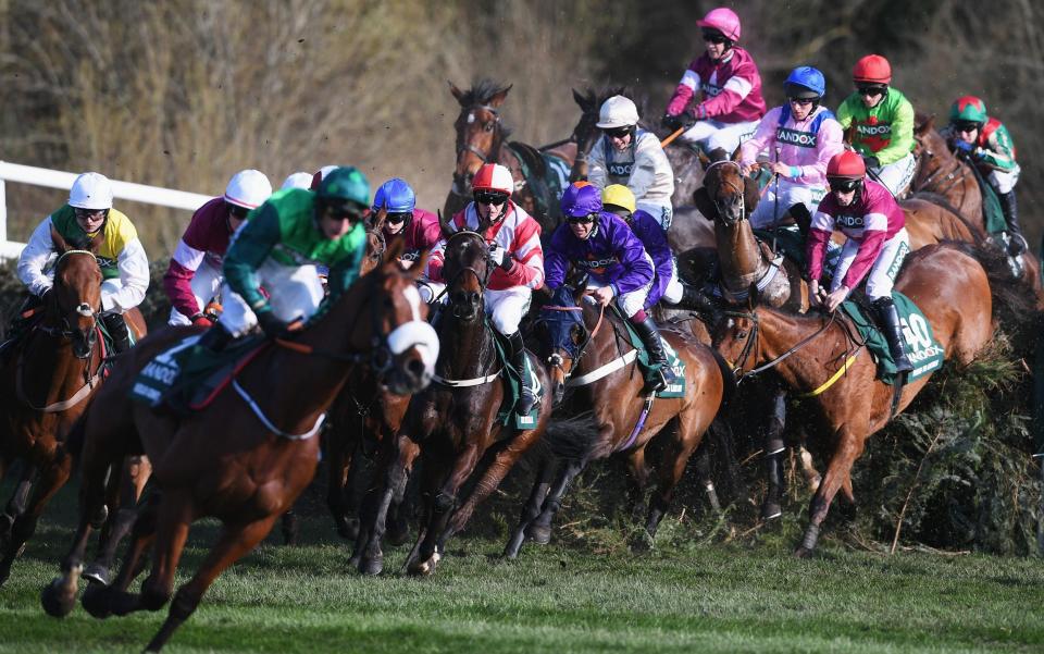 Runners and riders jump Canal Turn during the 2018 Randox Health Grand National at Aintree - Getty Images