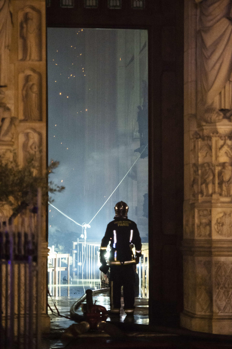 Embers fall from the ceiling inside the cathedral. Source: AAP