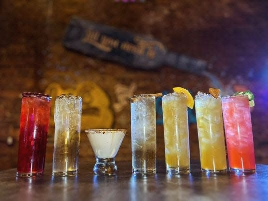 Inner Circle Vodka Bar's 2023 winter infusion cocktails. From left to right, Cranberry Crisp, Honey Pear Blitz, Nutty Espresso, Frostbite, Peach Pit, Not Your Grandma's Candy and Naughty But Nice.