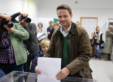 Rafal Trzaskowski, Civic Coalition candidate for mayor of Warsaw, casts a vote during the Polish regional elections, at a polling station in Warsaw, Poland, October 21, 2018. Dawid Zuchowicz/Agencja Gazeta via REUTERS
