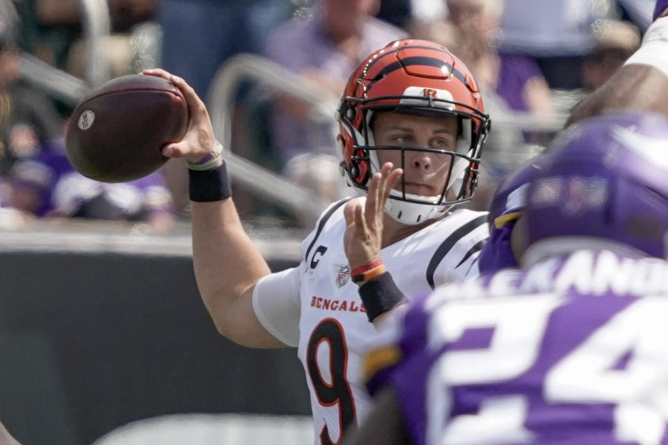 Cincinnati Bengals quarterback Joe Burrow (9) passes against the Minnesota Vikings in the first half of an NFL football game, Sunday, Sept. 12, 2021, in Cincinnati. (AP Photo/Jeff Dean)