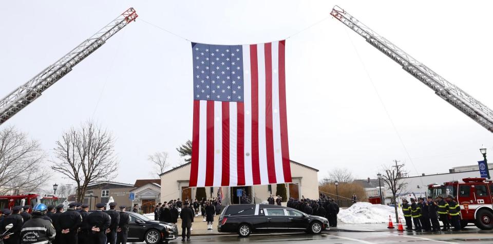 Boston police officer John O'Keefe, a Braintree native, was found dead outside a Canton home in the middle of a nor'easter on Jan. 29, 2022. His funeral was at St. Francis of Assisi Church in Braintree on Monday, Feb. 7, 2022.