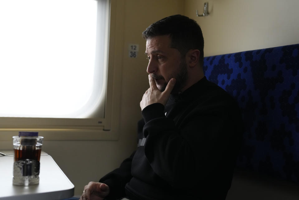 Ukrainian President Volodymyr Zelenskyy pauses during an interview with Julie Pace, senior vice president and executive editor of The Associated Press, on a train traveling from the Sumy region to Kyiv, Ukraine, Tuesday March 28, 2023. In the interview, Zelenskyy warned that unless his nation wins a drawn-out battle in the key eastern city of Bakhmut, Russia could begin building international support for a deal that could require Ukraine to make unacceptable compromises. (AP Photo/Efrem Lukatsky)