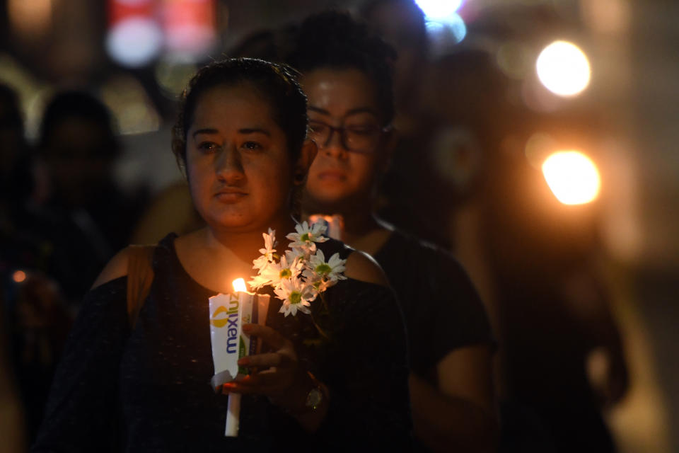 <p>Salvadoran women holding candles participate in a protest in commemoration of women murdered in El Salvador, as part of the celebration of International Women’s Day in San Salvador on March 8, 2018. (Photo: Marvin Recinos/AFP/Getty Images) </p>