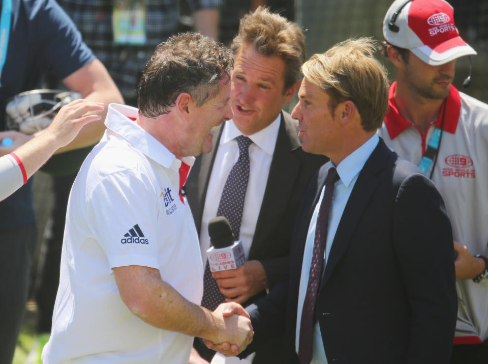 MELBOURNE, AUSTRALIA - DECEMBER 27:  Piers Morgan shakes the hand of Shane Warne (R) as Mark Nicholas (C) looks on after facing deliveries from former Australian cricketer Brett Lee in the nets during day two of the Fourth Ashes Test Match between Australia and England at Melbourne Cricket Ground on December 27, 2013 in Melbourne, Australia.  (Photo by Scott Barbour/Getty Images)