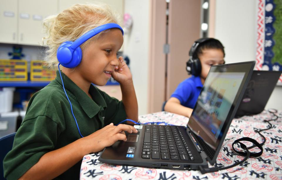 Abijah Quamina, 5, follows a lesson on a laptop at Alta Vista Elementary School’s Eagle Academy.