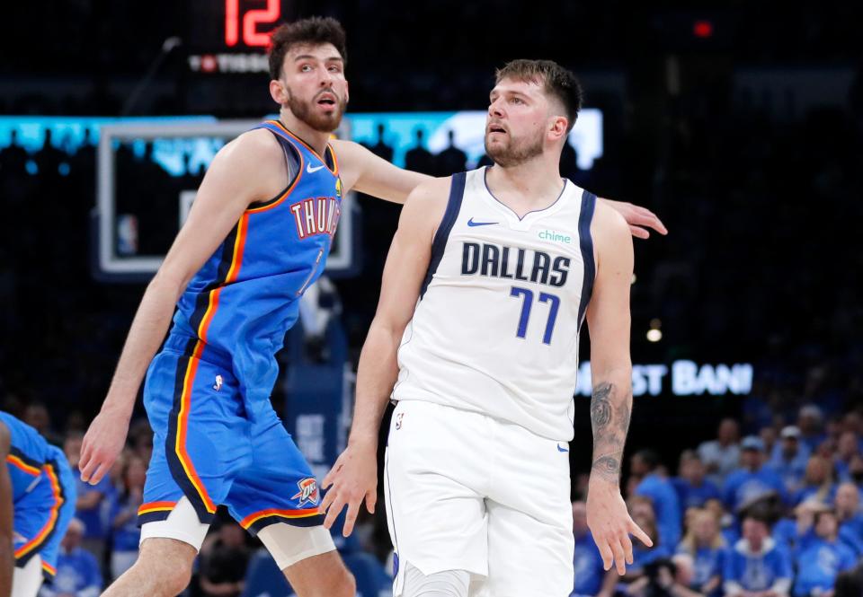Mavericks guard Luka Doncic (77) reacts to his basket next to Thunder forward Chet Holmgren (7) in the second half of Game 2 of the Western Conference semifinals Thursday night at Paycom Center.