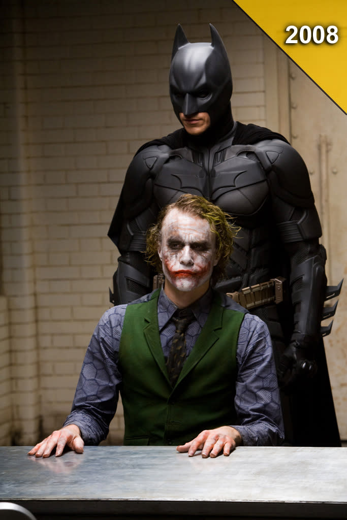 <a href="http://movies.yahoo.com/movie/the-dark-knight/" data-ylk="slk:THE DARK KNIGHT;elm:context_link;itc:0;sec:content-canvas" class="link ">THE DARK KNIGHT</a> <br>Directed by: <span>Christopher Nolan</span> <br>Starring: <span>Christian Bale</span>, <span>Heath Ledger</span>, <span>Aaron Eckhart</span>