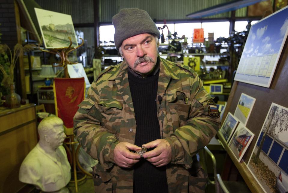 In this photo taken on Sunday, Nov. 3, 2019, Lev Zheleznyov, director of the 'Museum of Industrial Culture' speaks to the Associated Press in Moscow, Russia. Moscow’s suburbs are the focus of a major international art exhibition that has just opened in the Russian capital. The exhibit uses contemporary art to explore the many hidden facets of life beyond the Russian capital’s nucleus. Austrian cultural attache says the ‘real’ Moscow where most of the city’s 12.6 million people live, is outside the center. (AP Photo/Alexander Zemlianichenko)