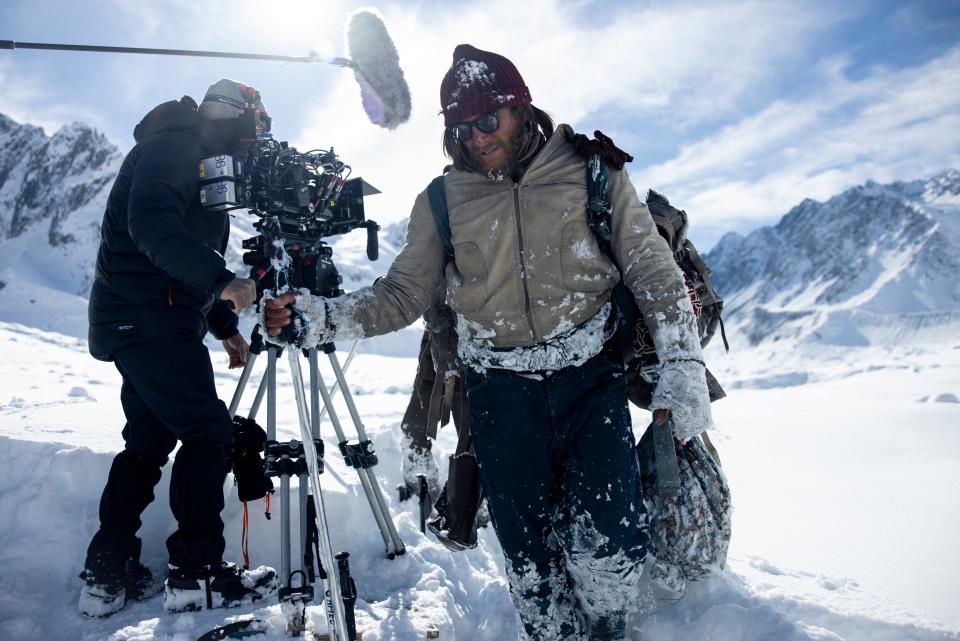 Some of the crew set up a shot during the making of "Society of the Snow," the re-telling of a famous 1973 plane crash high in the Andes. Some of the film was shot at the original crash site.