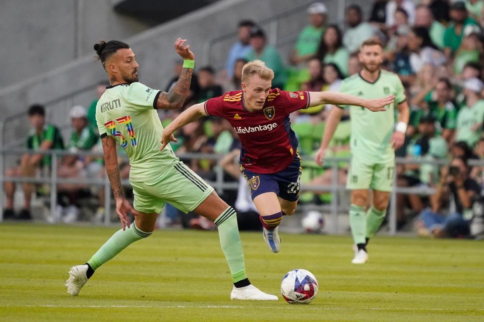 June 3, 2023;  Austin, Texas, USA;  Austin FC forward Maximiliano Urruti (37) battles for ball possession against Real Salt Lake defender Jasper Loffelsend (28) during the first half at Q2 Stadium.