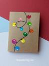 <p>This is an easy one for kids to do — their finger-paint fingerprints can easily be transformed into a string of holiday lights. If you don't have finger paint, you might be able to achieve something similar with stamp pads.</p><p><a href="https://www.thejoysharing.com/2020/12/fingerprint-lights-christmas-card.html" rel="nofollow noopener" target="_blank" data-ylk="slk:Get the tutorial at The Joy of Sharing »;elm:context_link;itc:0;sec:content-canvas" class="link "><em>Get the tutorial at The Joy of Sharing »</em></a></p>