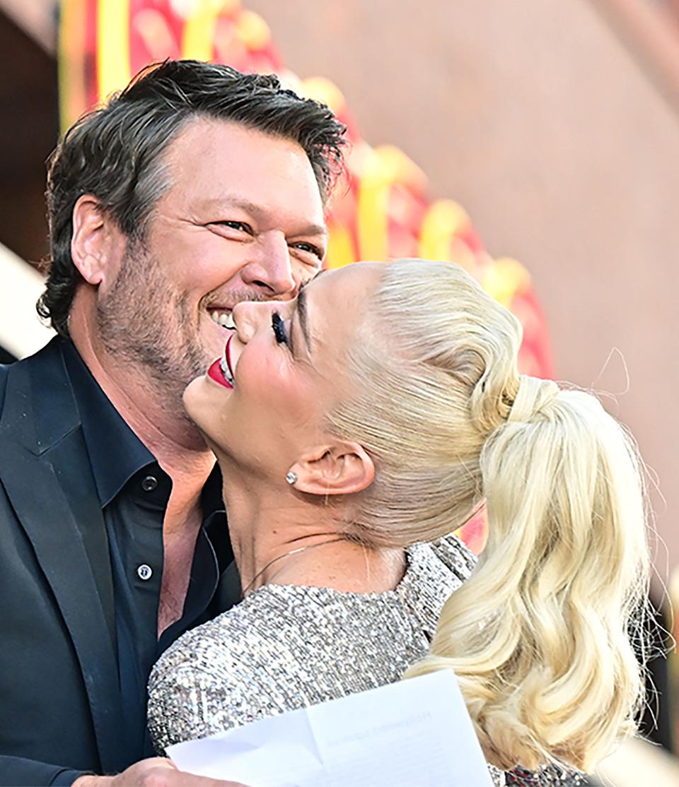 Gwen Stefani and husband Blake Shelton embrace during her Hollywood Walk of Fame Star ceremony on Oct. 19, 2023, in Los Angeles.