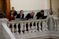 <p>Reporters work outside the courtroom during a break in the Bill Cosby trial in the Montgomery County Courthouse in Norristown, Pa., June 12, 2017. (Photo: David Maialetti/Pool/Reuters) </p>