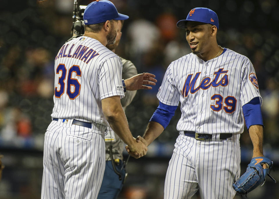 Jun 30, 2019; New York City, NY, USA; New York Mets manager Mickey Callaway (36) and pitcher Edwin Diaz (39) celebrate the 8-5 victory over the Atlanta Braves at Citi Field. Mandatory Credit: Wendell Cruz-USA TODAY Sports