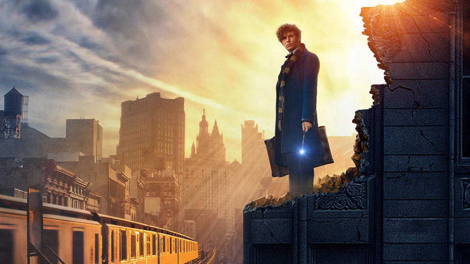 Newt Scamander, played by Eddie Redmayne, stands on a rooftop in Fantastic Beasts and Where to Find Them.