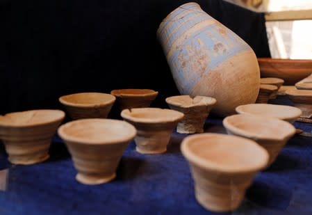 Artifacts are displayed during the presentation of a new discovery in the Monkey Valley near the Valley of the Kings in Luxor