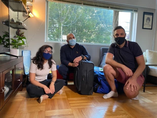 From left, Julnar Doueik, Charbel Elia and Patrick Rmeily will fly to Beirut later this week, carrying six suitcases filled with medications and essential supplies that have become near impossible to find in Lebanon. (Michelle Ghoussoub/CBC - image credit)