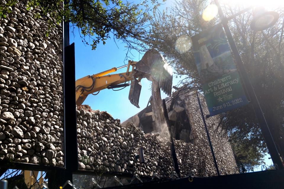 An excavator pulls down a steel I-beam as it digs through the area that used to house the Photography Department at the former Abilene Reporter-News building Oct. 25.