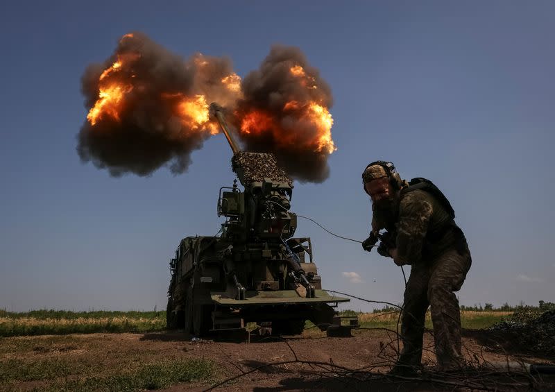 A Ukrainian serviceman fires a 2S22 Bohdana self-propelled howitzer towards Russian troops at a position near the city of Bakhmut