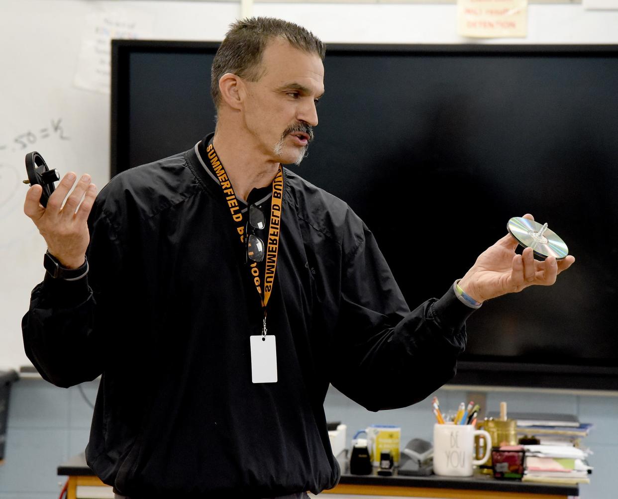 Summerfield High School seventh and eighth grade science, computers and STEM Enrichment teacher Scott DuVall talks about how his STEM students created tops in class. "We had a spin-off to see whose top would spin the longest," said DuVall.