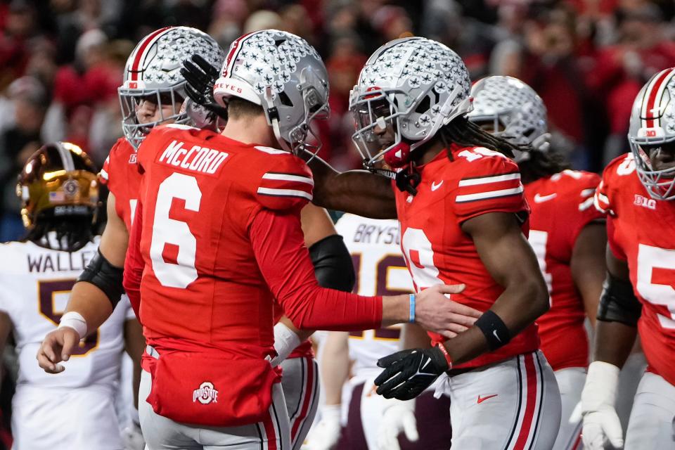 Nov 18, 2023; Columbus, Ohio, USA; Ohio State Buckeyes quarterback Kyle McCord (6) and wide receiver Marvin Harrison Jr. (18) celebrate a touchdown connection during the NCAA football game against the Minnesota Golden Gophers at Ohio Stadium.