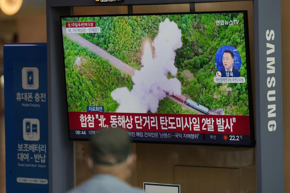 A TV screen showing a news program reporting about North Korea's missile launch with file footage, is seen at the Seoul Railway Station in Seoul, South Korea, Saturday, Oct. 1, 2022. On Saturday, North Korea fired two short-range ballistic missiles toward its eastern waters, South Korean and Japanese officials said, making it the fourth round of weapons launches this week that are seen as a response to military drills among its rivals. (AP Photo/Lee Jin-man)