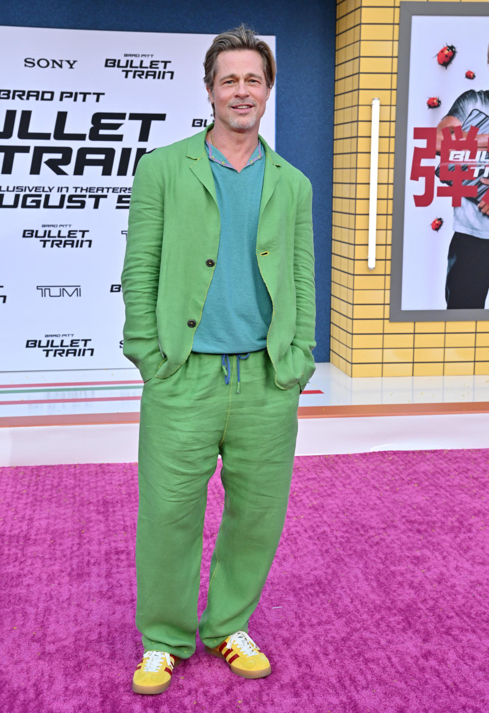 Brad Pitt wearing a green suit on the Bullet Train LA premiere red carpet