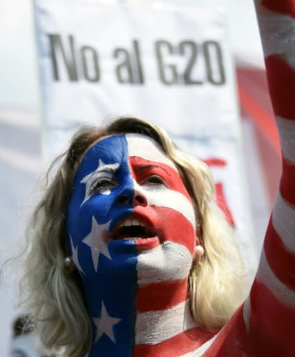 One protester said she painted herself in the colors of the US flag to denounce President Donald Trump's "imperialism and his lack of respect for women"