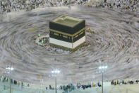 Muslim pilgrims circle around the Kaaba, the cubic building at the Grand Mosque, ahead of the annual Hajj pilgrimage, in the Muslim holy city of Mecca, Saudi Arabia, early Friday, Aug. 17, 2018. The annual Islamic pilgrimage draws millions of visitors each year, making it the largest yearly gathering of people in the world. (AP Photo/Dar Yasin)