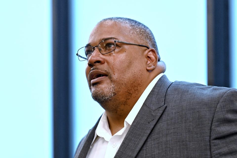 Sexton High School principal Daniel Boggan becomes emotional during a rebranding community meeting on Wednesday, Sept. 28, 2022, at the school in Lansing.