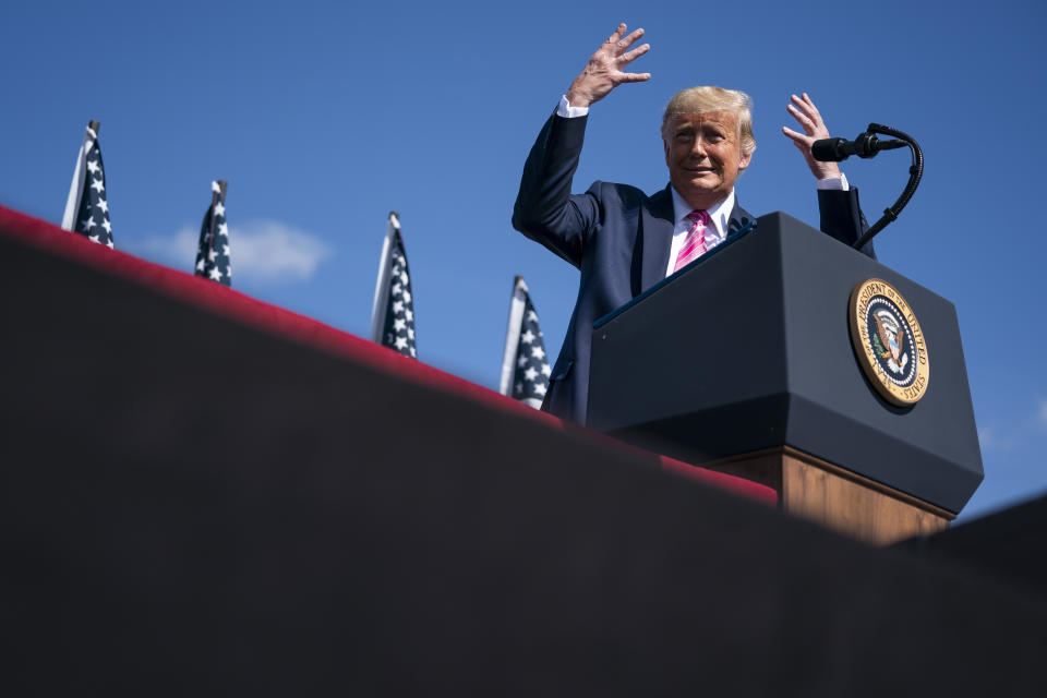 President Donald Trump jokes about the bright sun as he speaks during a campaign rally at Robeson County Fairgrounds, Saturday, Oct. 24, 2020, in Lumberton, N.C. (AP Photo/Evan Vucci)