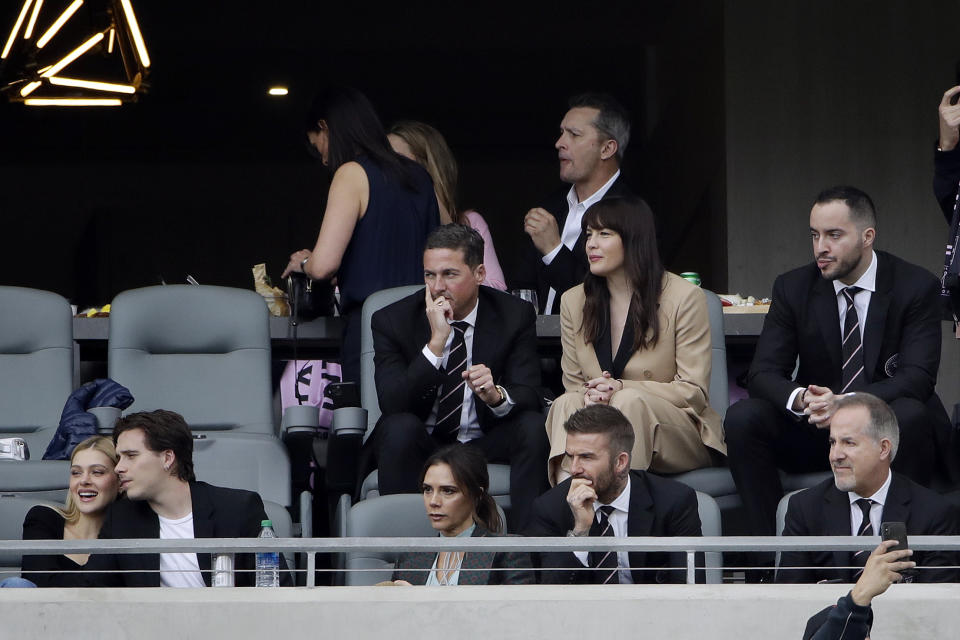 David Beckham, bottom right, watches an MLS soccer match between Los Angeles FC and Inter Miami CF alongside his family, including wife Victoria and son Brooklyn Sunday, March 1, 2020, in Los Angeles. (AP Photo/Marcio Jose Sanchez)