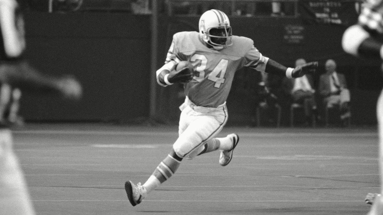 Mandatory Credit: Photo by Ed Kolenovsky/AP/Shutterstock (6031629a)Earl Campbell, Shane Nelson Houston Oilers? running back, Earl Campbell (34) rambles around his right end after taking a pitchout to pick up three yards in the second quarter of the NFL game at Houston, .