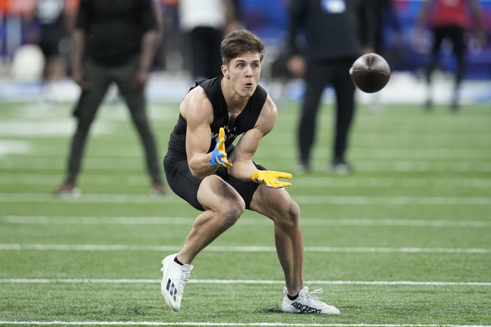 Rice wide receiver Luke McCaffrey runs a drill at the NFL football scouting combine, Saturday, March 2, 2024, in Indianapolis. (AP Photo/Darron Cummings)