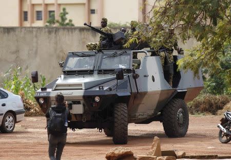 Presidential guard soldiers are seen on an armoured vehicle at Laico hotel in Ouagadougou, Burkina Faso, September 20, 2015. REUTERS/Joe Penney