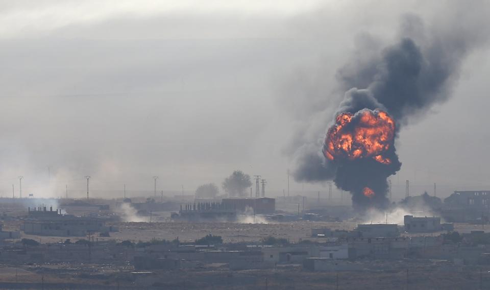 An explosion is seen over the Syrian town of Ras al-Ain as seen from the Turkish border town of Ceylanpina (REUTERS)