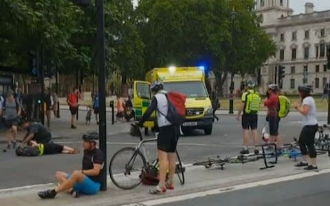 Injured cyclists on the ground after the car crashed into them - Credit: Twitter