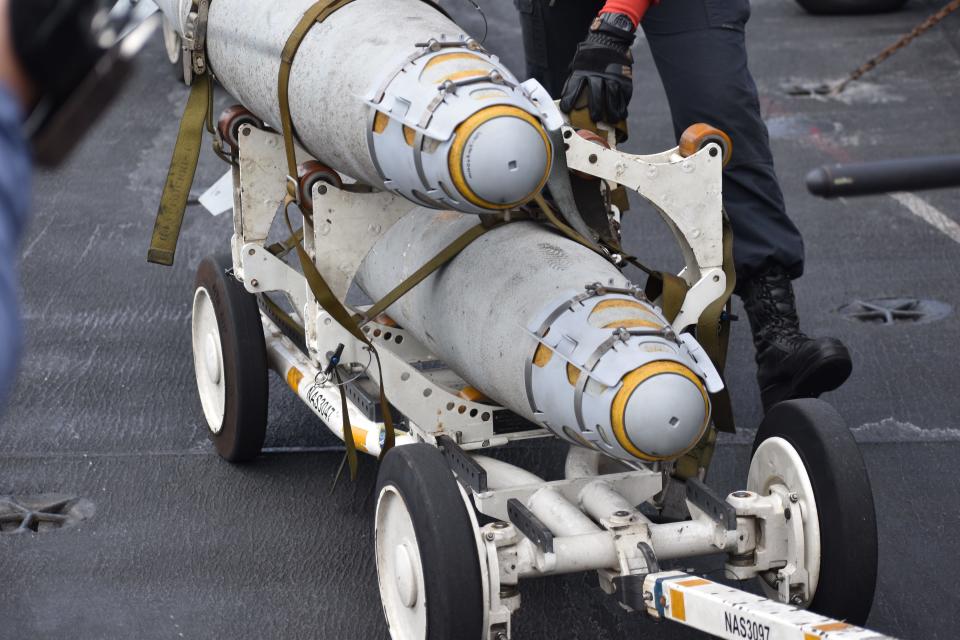 Sailors transport munitions on the deck of the USS Dwight D. Eisenhower.