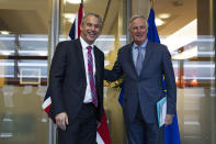 UK Brexit secretary Stephen Barclay, left, is welcomed by European Union chief Brexit negotiator Michel Barnier before their meeting at the European Commission headquarters in Brussels, Friday, Oct. 11, 2019. (AP Photo/Francisco Seco, Pool)