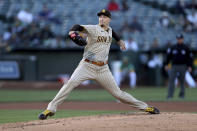 San Diego Padres' Blake Snell throws to an Oakland Athletics batter during the first inning of a baseball game in Oakland, Calif., Tuesday, Aug. 3, 2021. (AP Photo/Jed Jacobsohn)