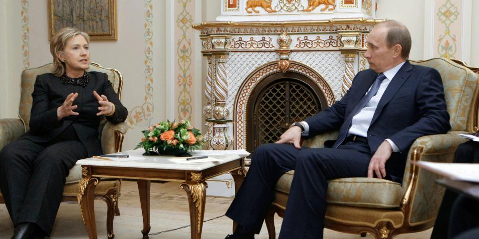 President Vladimir Putin seated with Secretary of State Hillary Clinton, who is talking in a 2010 meeting