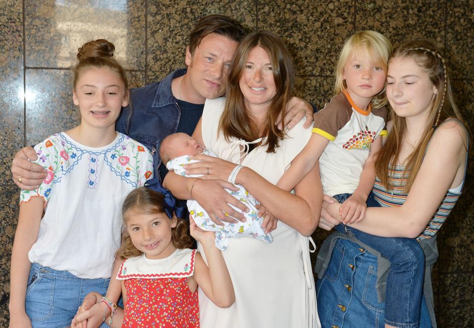 Jools and Jamie Oliver leave the Portland Hospital in central London with the newest addition to the Oliver family, a baby boy who has yet to be named, and their older children (left to right) Daisy Boo Pamela, Petal Blossom Rainbow, Buddy Bear Maurice and Poppy Honey Rosie.