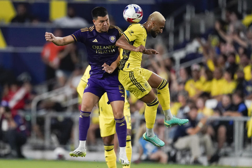 Orlando City midfielder César Araújo (left) and Nashville SC midfielder Hany Mukhtar jump for the ball during an MLS soccer match on Oct. 4 in Nashville, Tennessee. Orlando won 1-0. (AP Photo/George Walker IV)