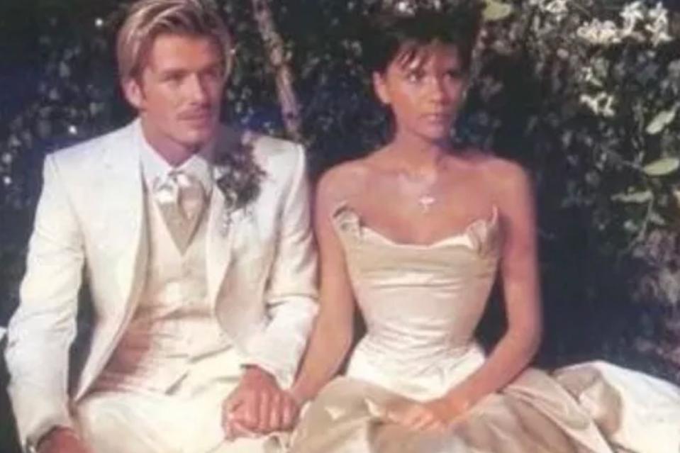 <p>David Beckham/Instagram</p> David and Victoria Beckham pose on their wedding day in 1999.