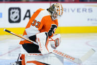 Philadelphia Flyers' Samuel Ersson blocks a shot during the third period of a preseason NHL hockey game against the New York Islanders, Tuesday, Sept. 28, 2021, in Philadelphia. (AP Photo/Matt Slocum)