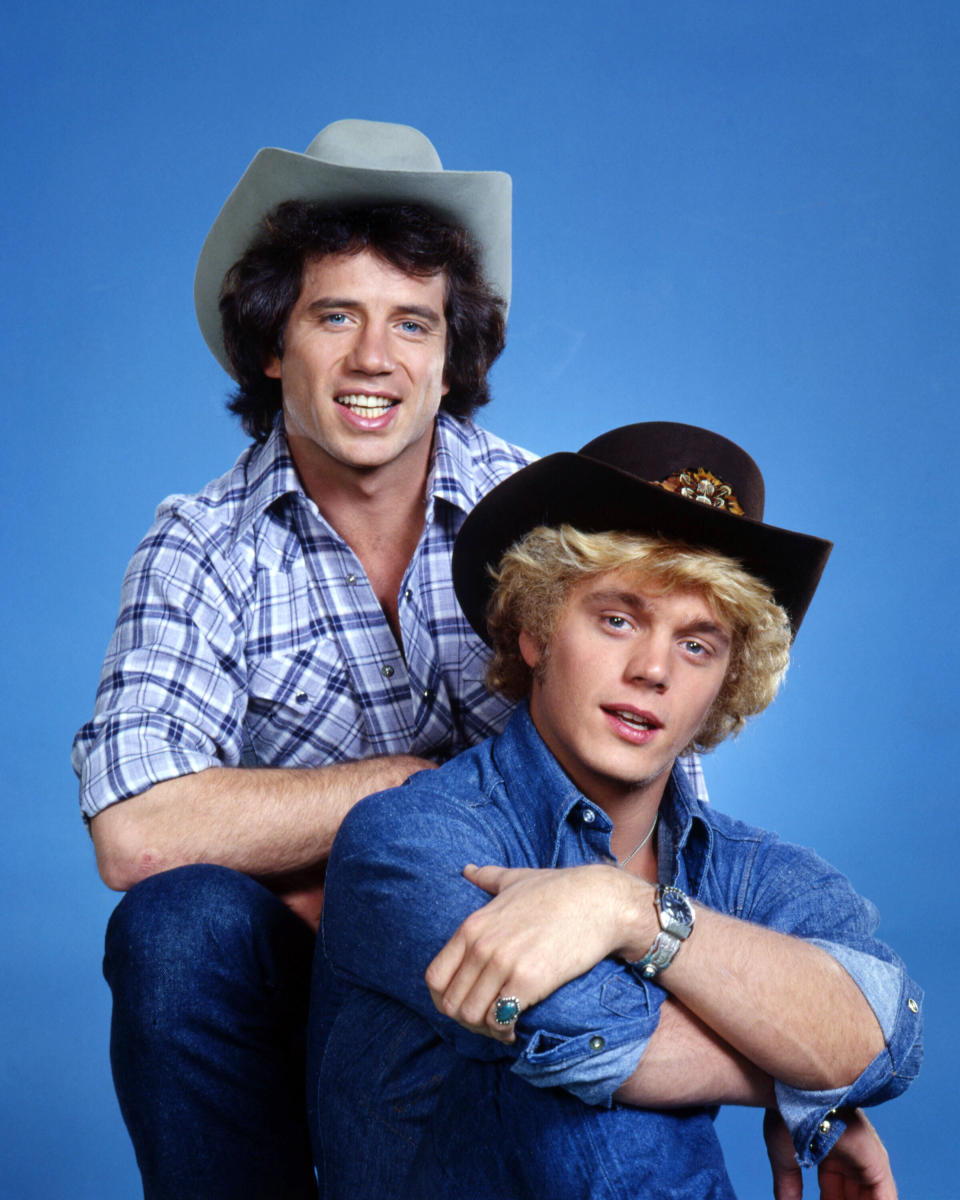 Tom Wopat (left) and John Schneider in a promotional portrait for "The Dukes of Hazzard." On the show, they drove a customized Dodge Charger that was called &ldquo;General Lee&rdquo; and had a Confederate flag on its roof.  (Photo: Silver Screen Collection via Getty Images)
