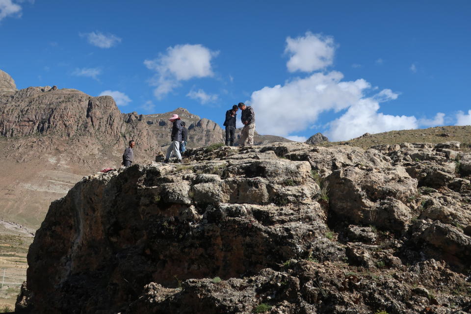 The team led by Dr. David Zhang from Guangzhou University in China visits the research site in Quesang, Tibet where human footprints and handprints thought to be the earliest known cave art were discovered.<span class="copyright">Courtesy Dr. David Zhang</span>