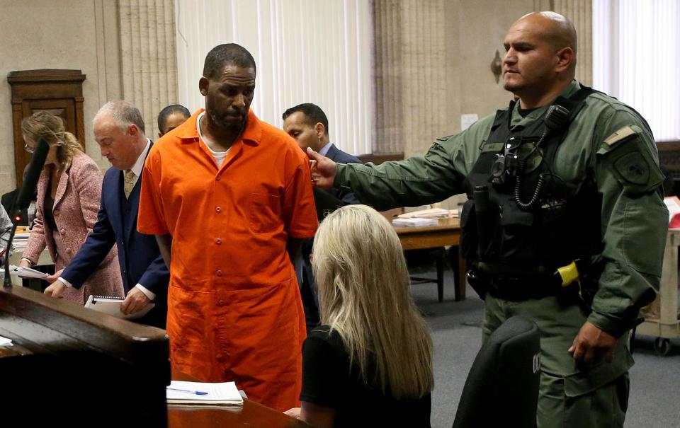 R Kelly turns to leave after appearing at a hearing at the Leighton Criminal Courthouse last year(Getty Images)