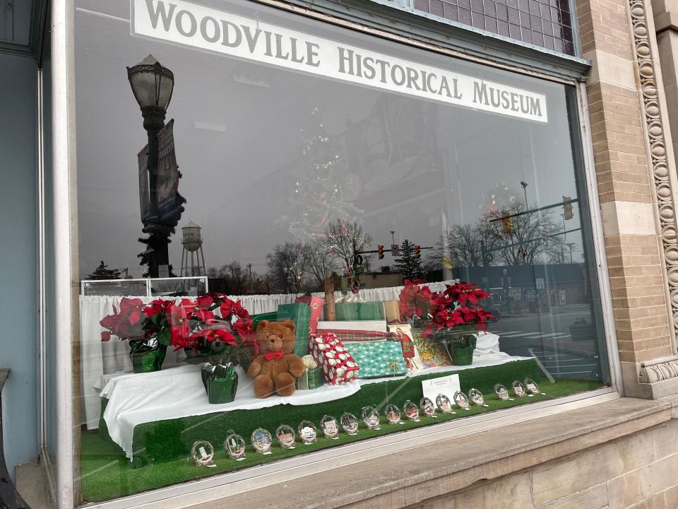 The window at the Woodville Historical Society is decorated for the holidays.